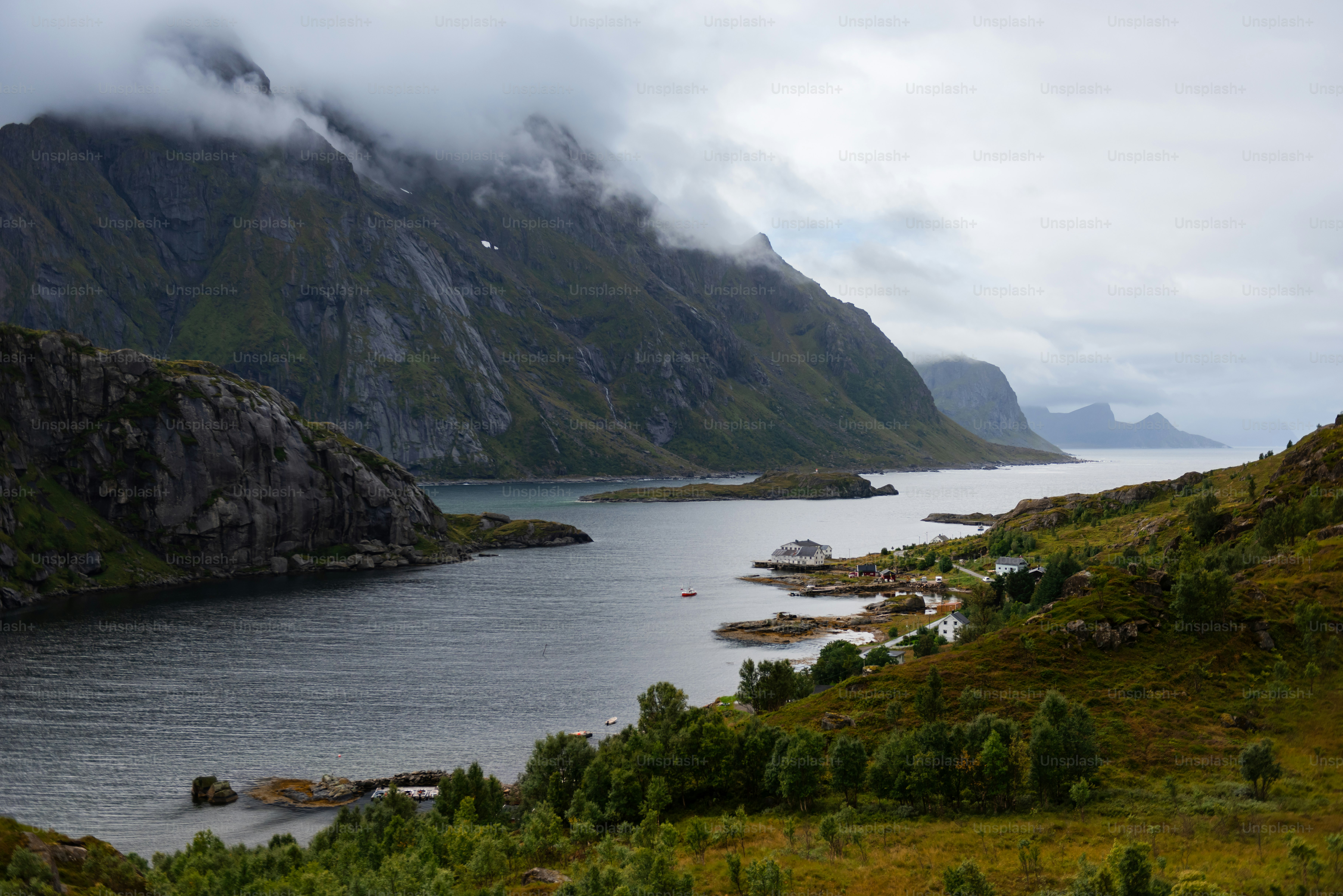 a body of water with mountains around it