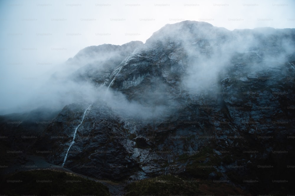 a mountain with a waterfall