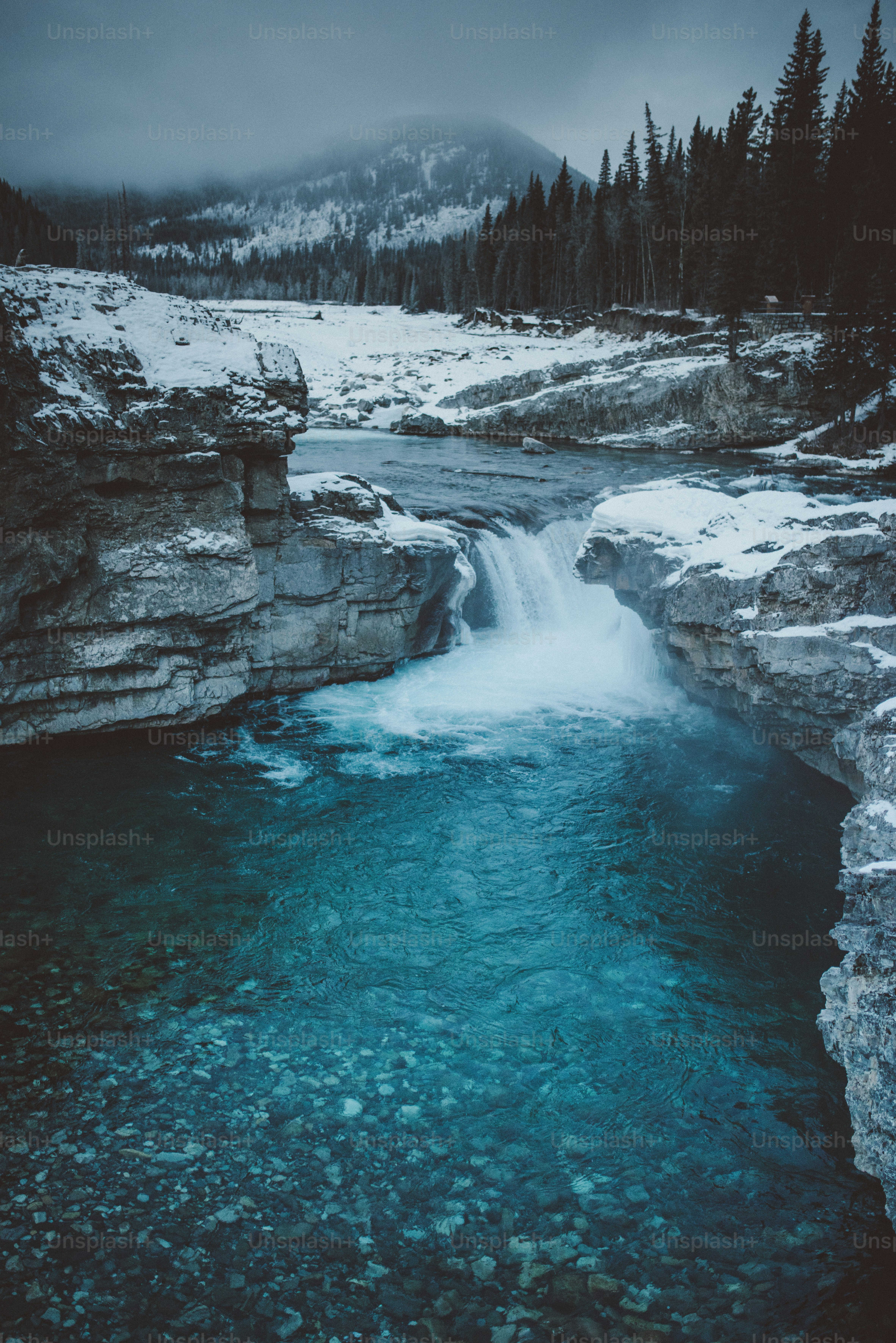 a river with ice and snow