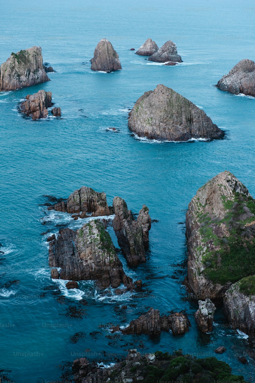 a group of rocks in the water