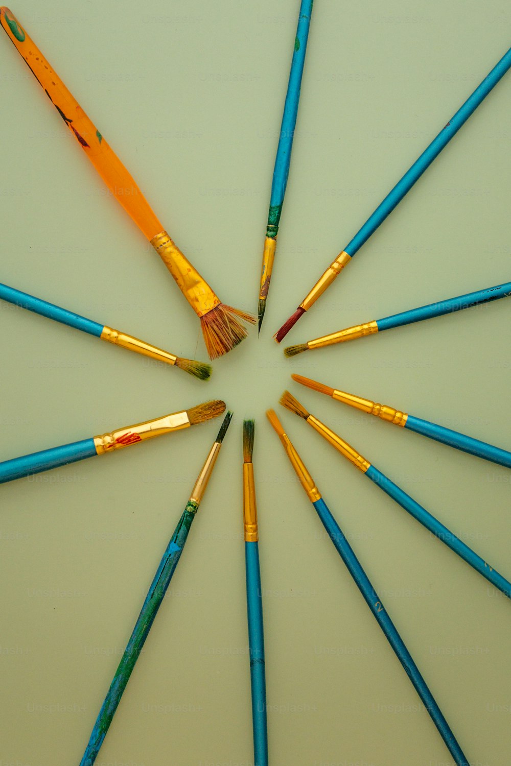 a group of colored pencils