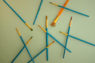 a group of colored pencils