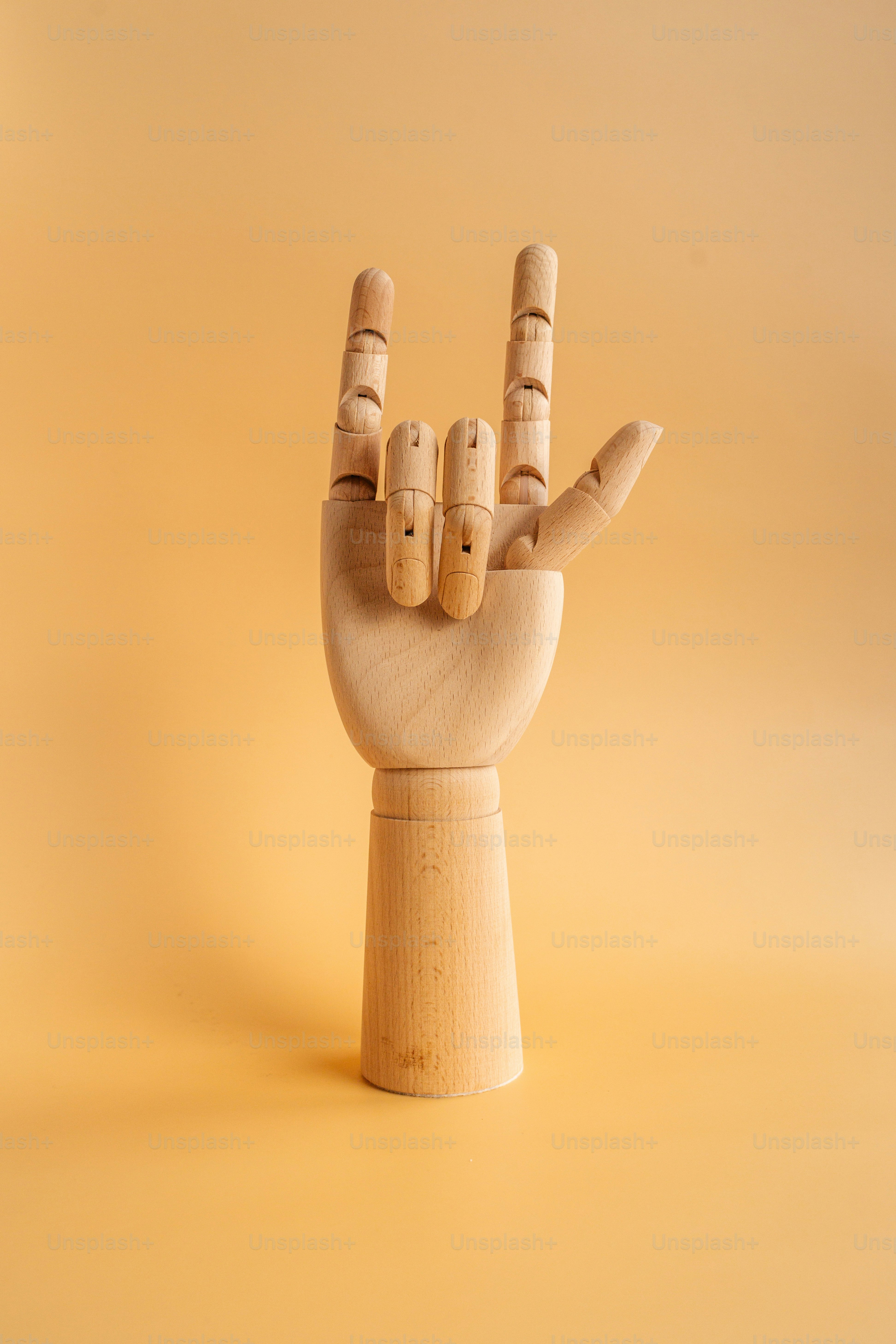 a hand holding a cigarette