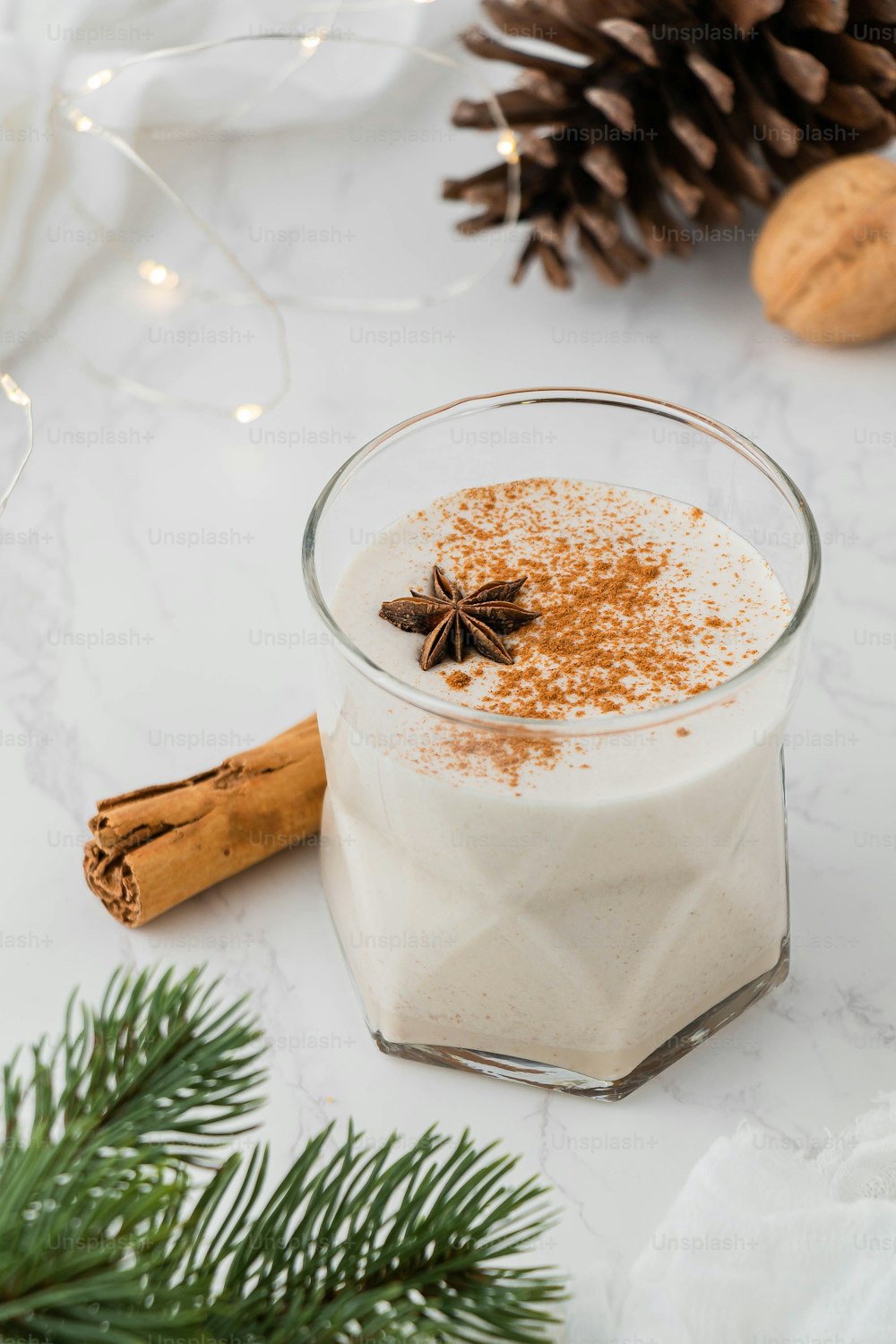 a glass of milk with a butterfly on top