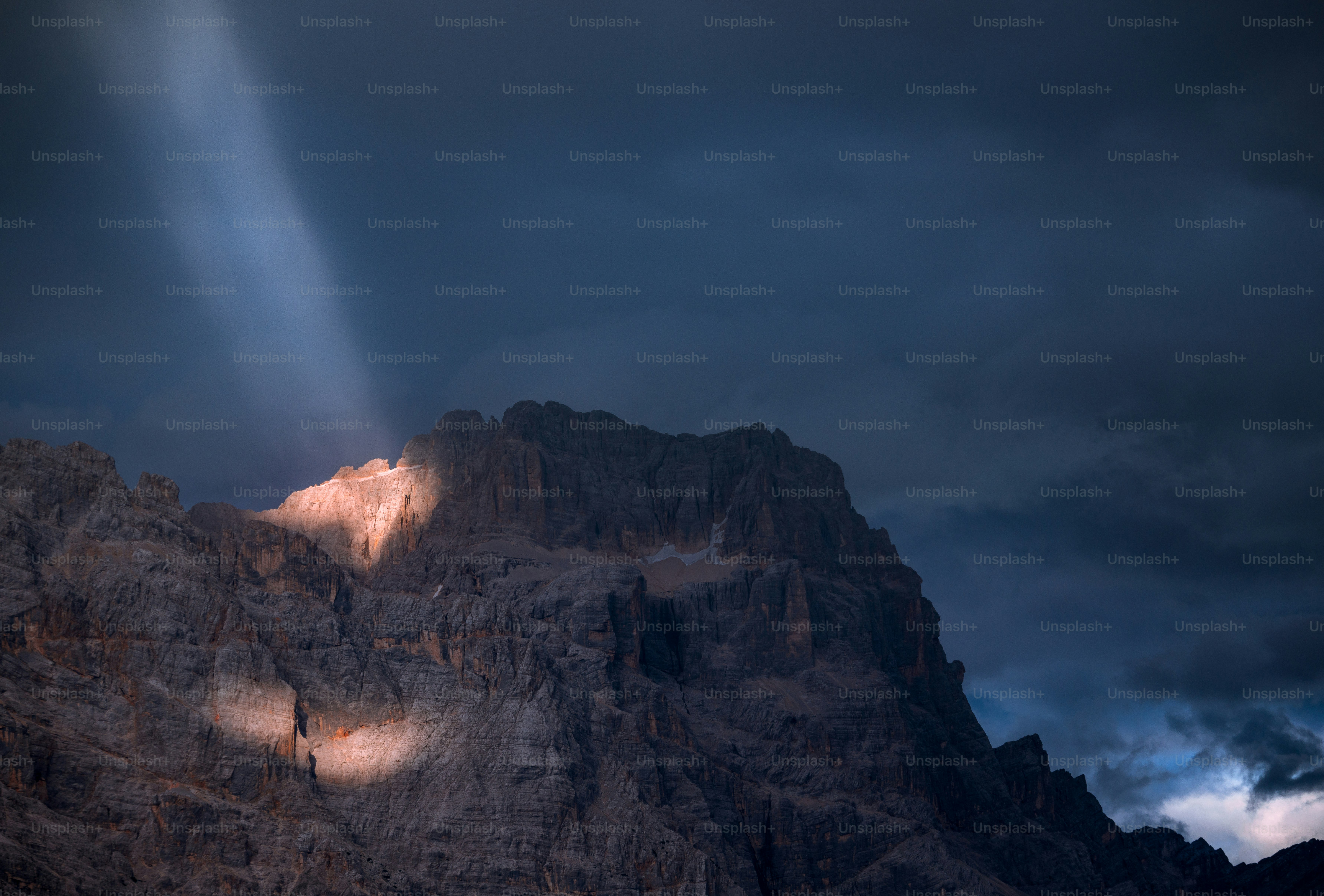 a mountain with a light shining on it