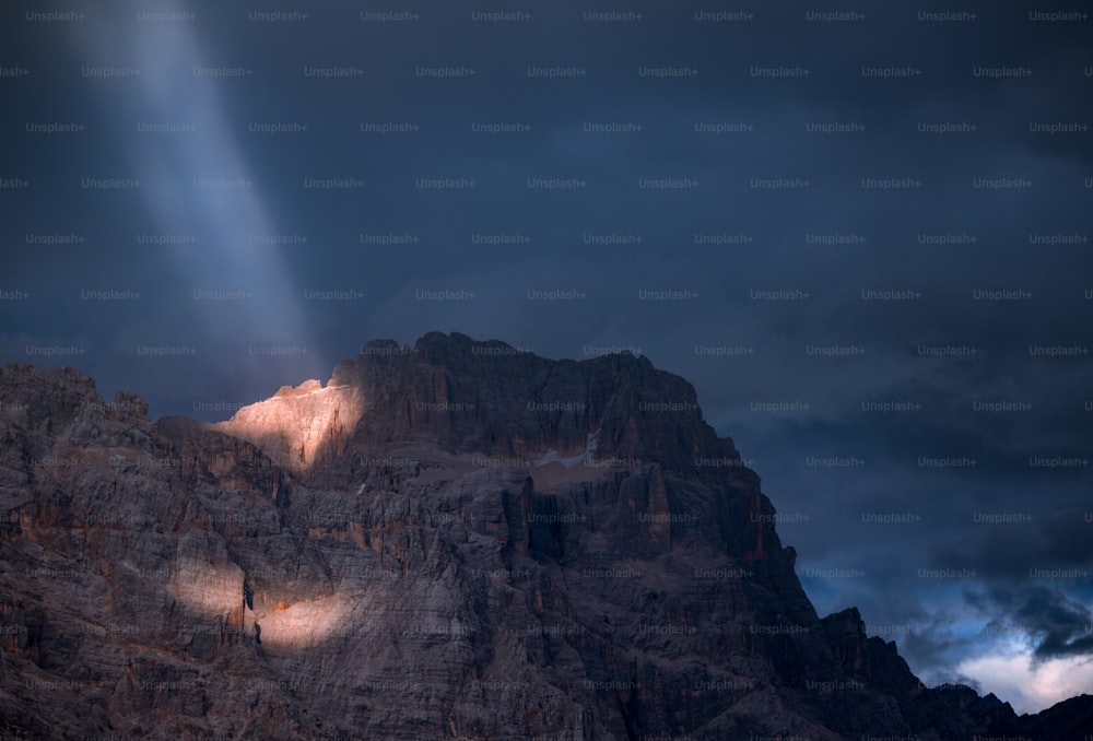 a mountain with a light shining on it