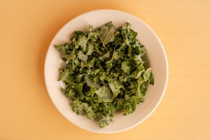 a bowl of green leaves