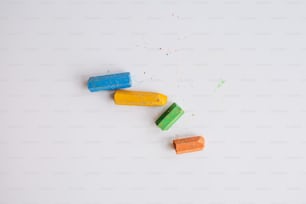 a group of different colored pills
