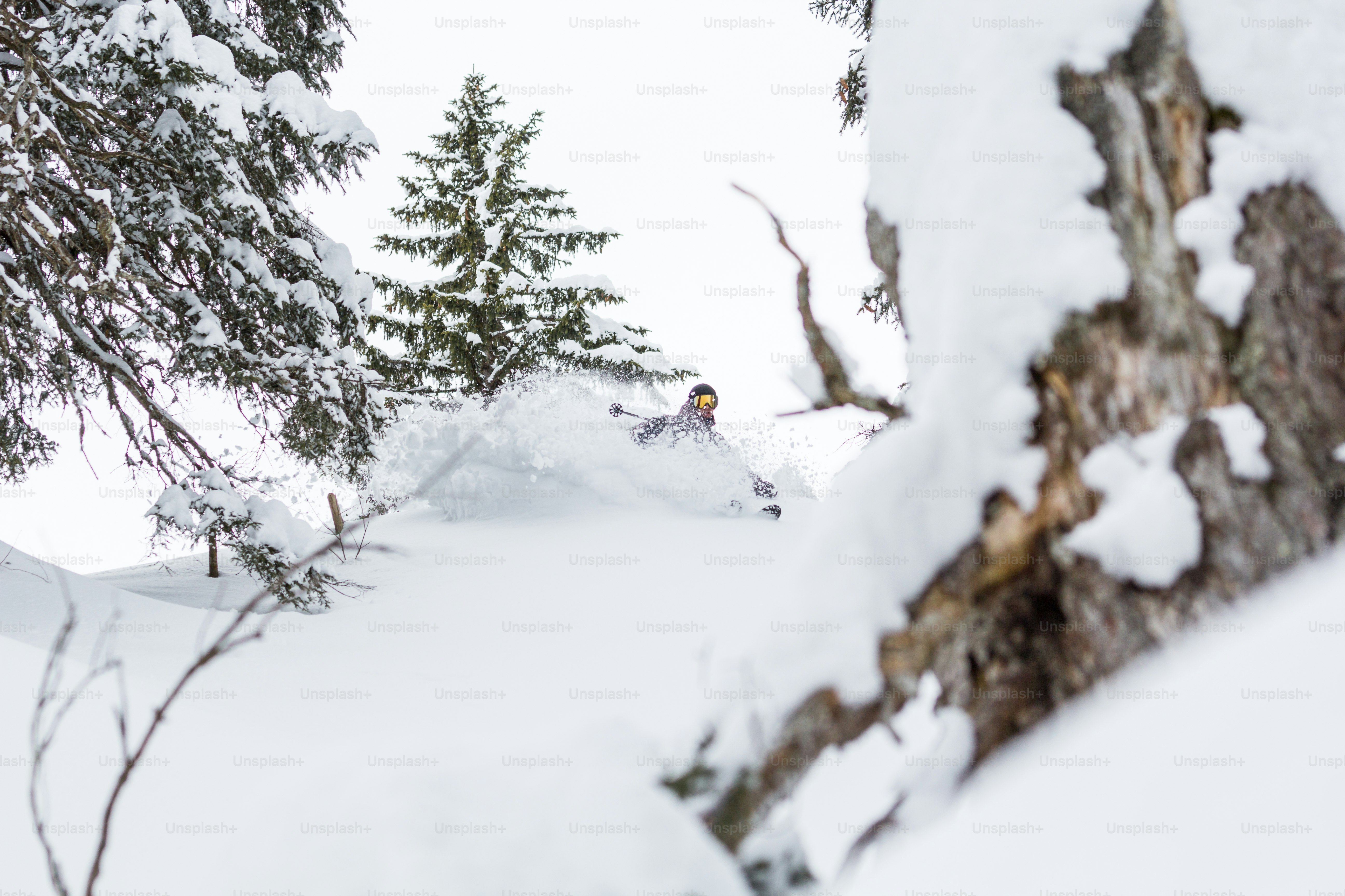 a person skiing down a snowy hill