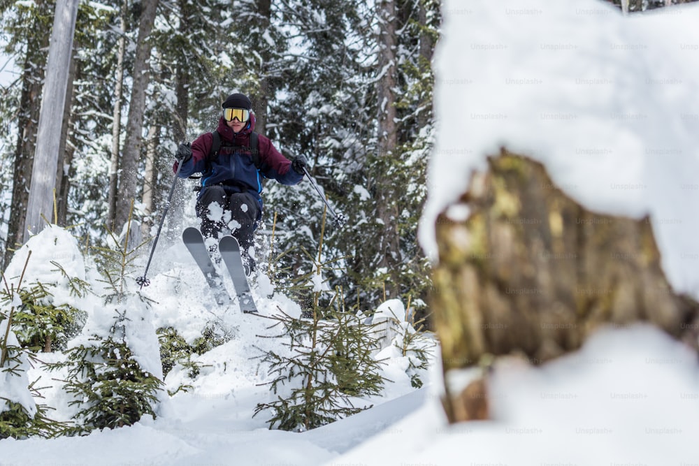 a person skiing down a snowy hill