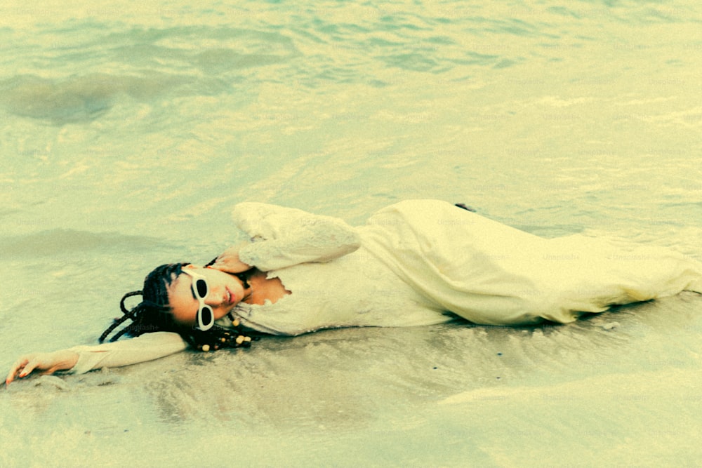 a man lying on the beach