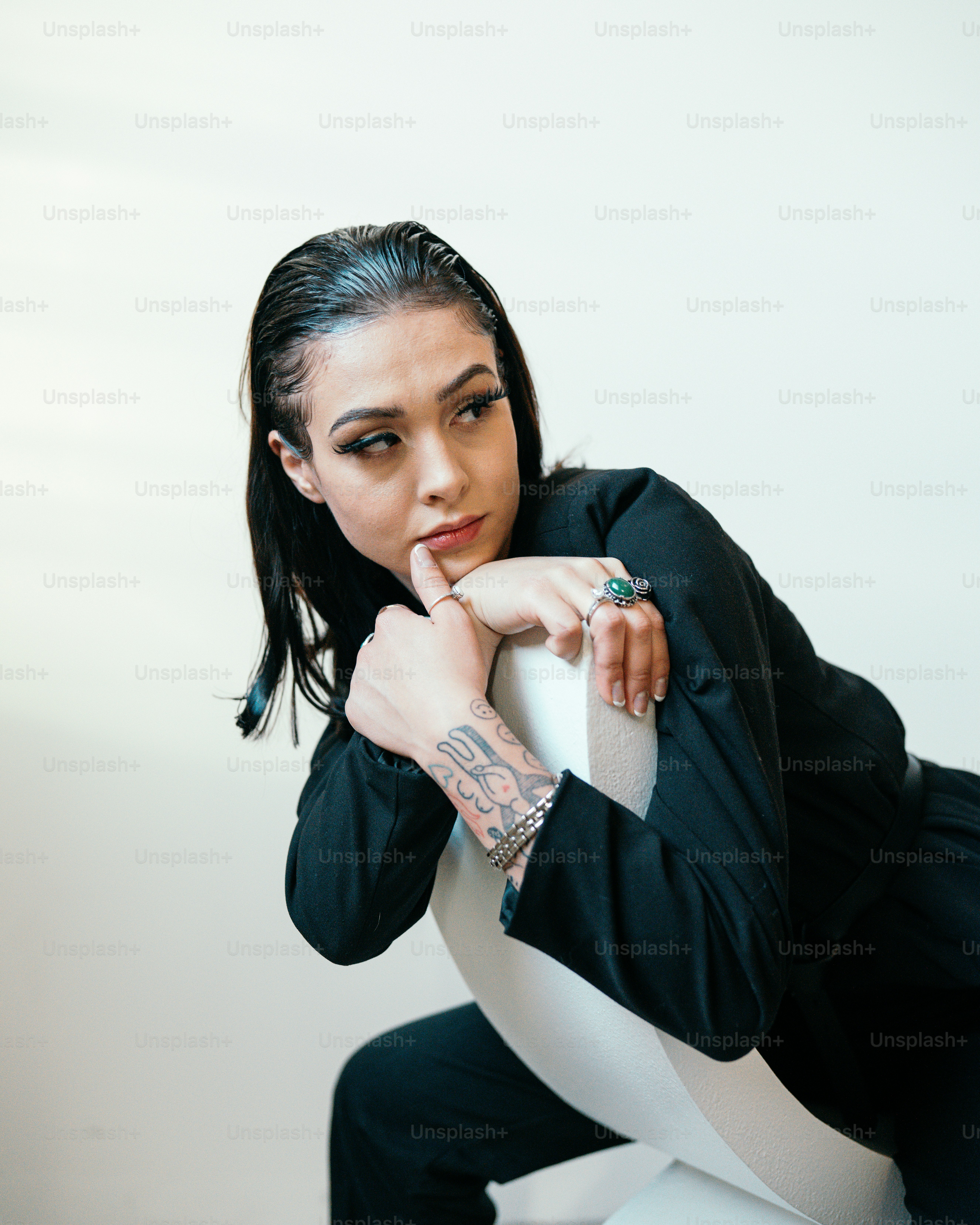 a person with the hand on the chin