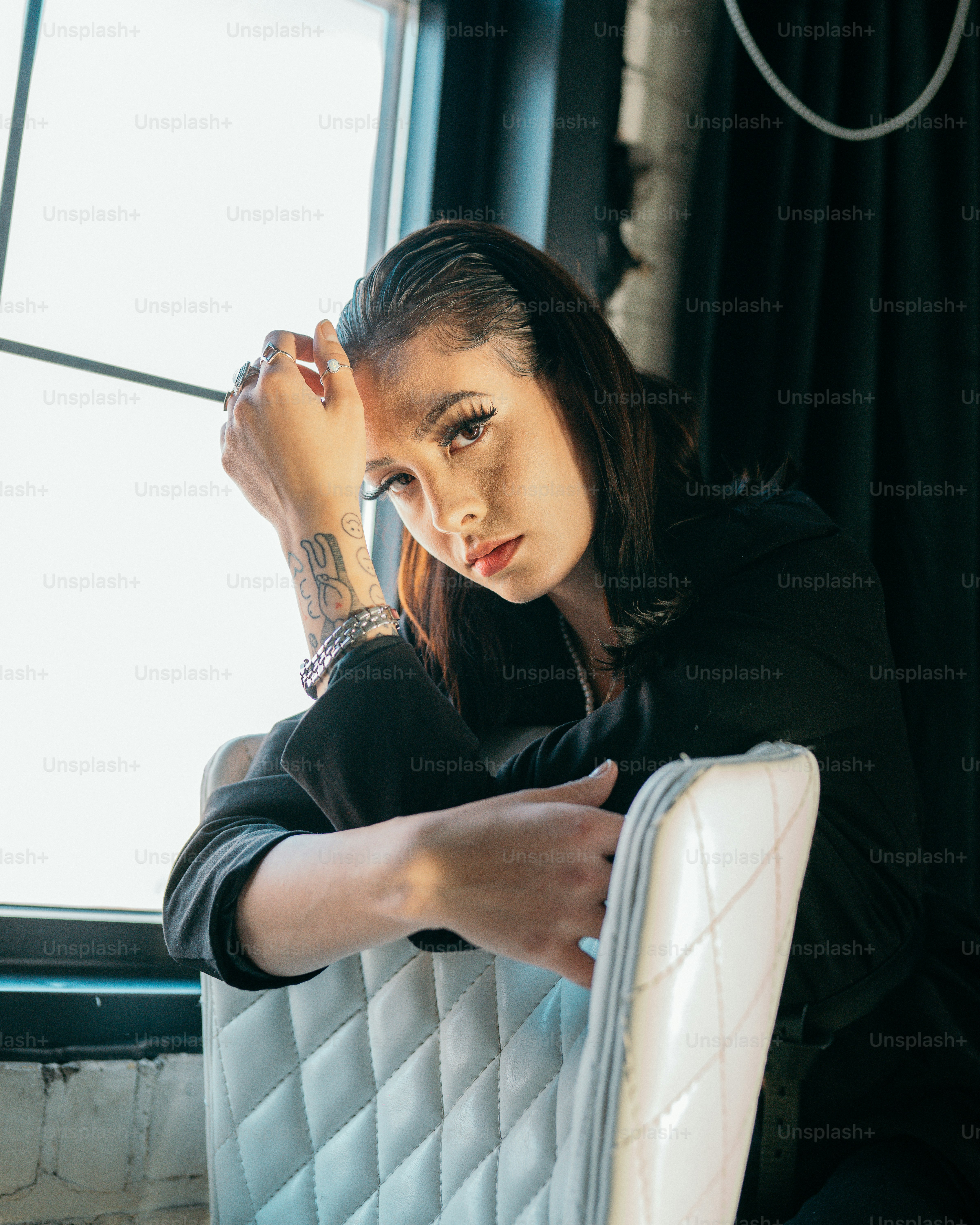 a person with the hand on the face