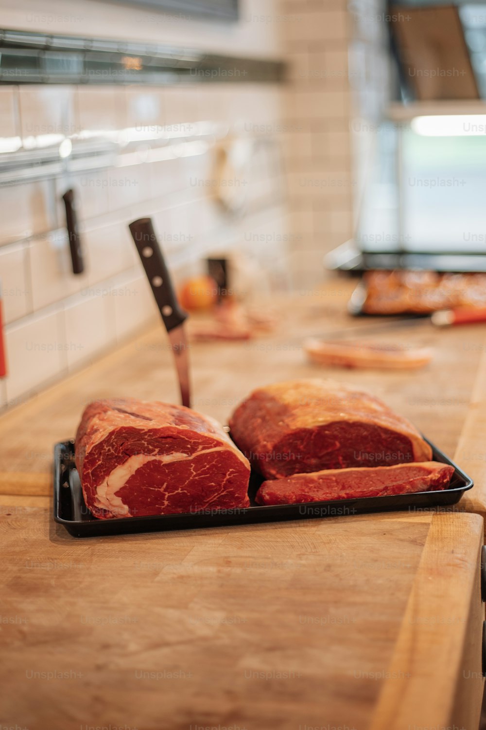 a knife on a cutting board with food on it