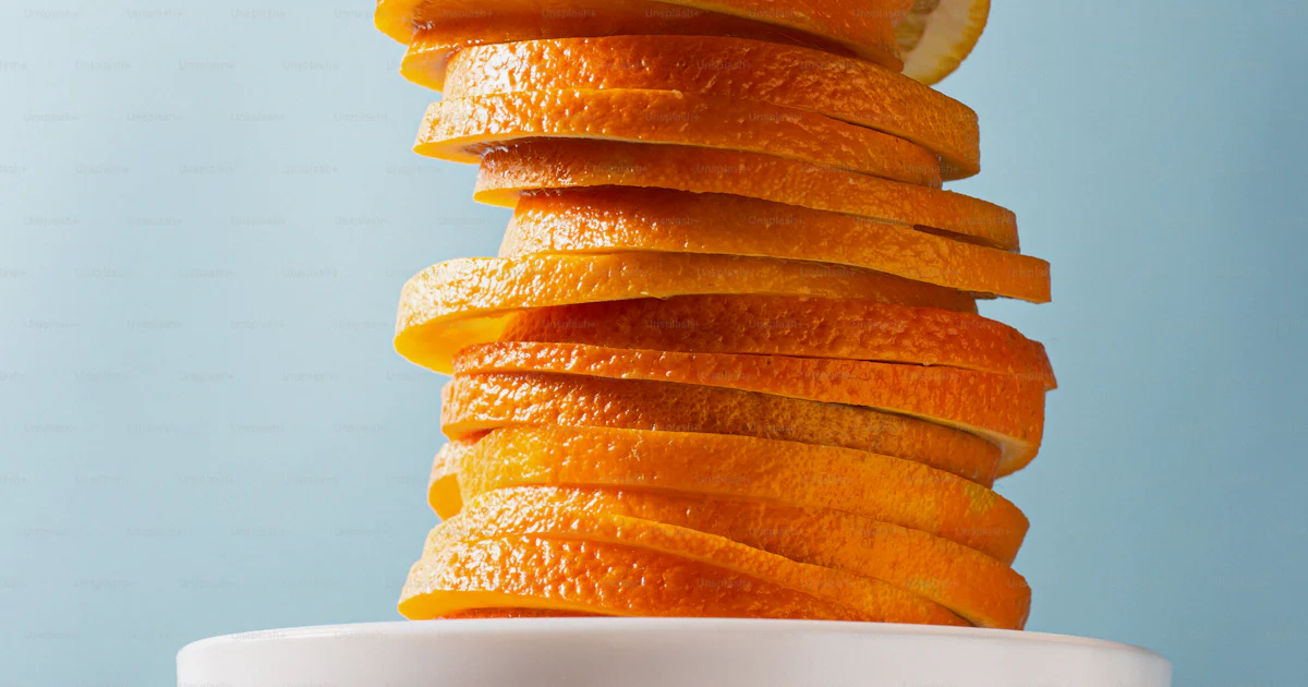 A stack of oranges photo – In studio Image on Unsplash