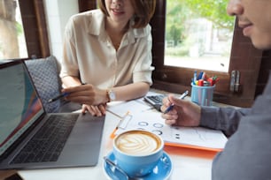 businessman in a coffee shop They are discussing