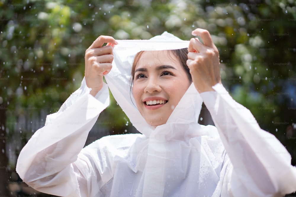 Asian woman she is happy on a rainy day.