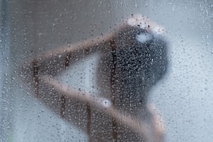 Asian woman washing hair and showering in the bathroom