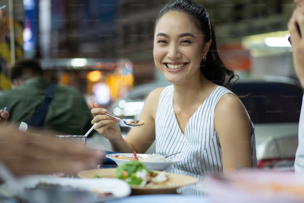 Asian people are eating Thailand street food dinner. Street dining.