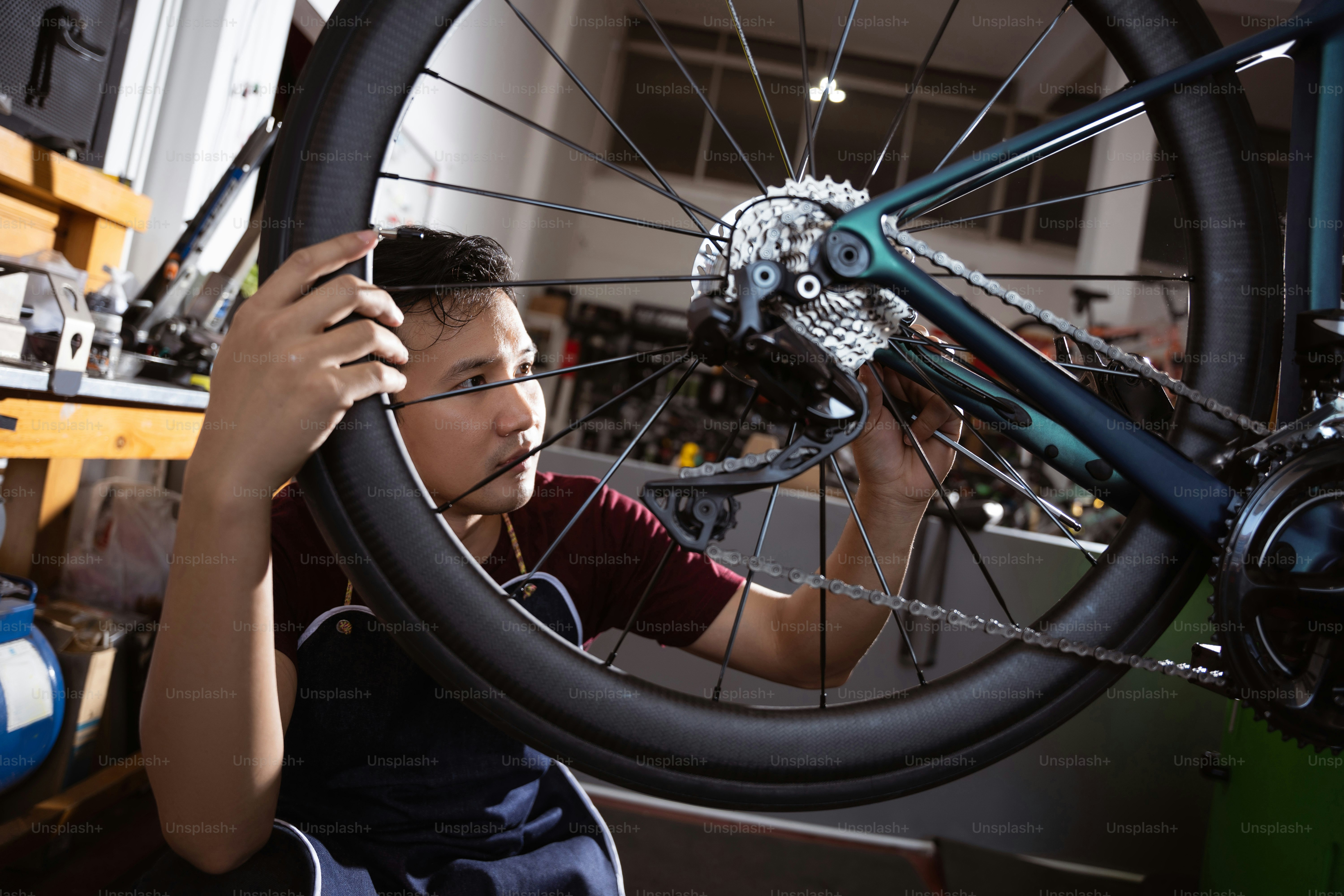 Repair technician bicycles was repaired gear bike shop. photo