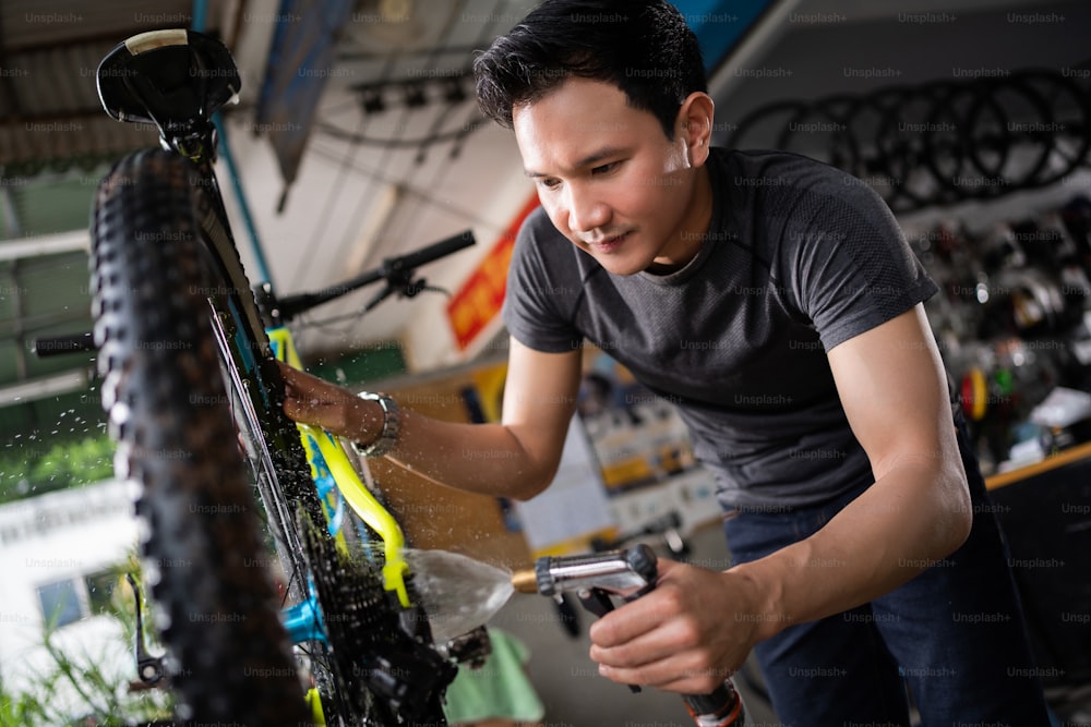 The mechanic is cleaning the bike.