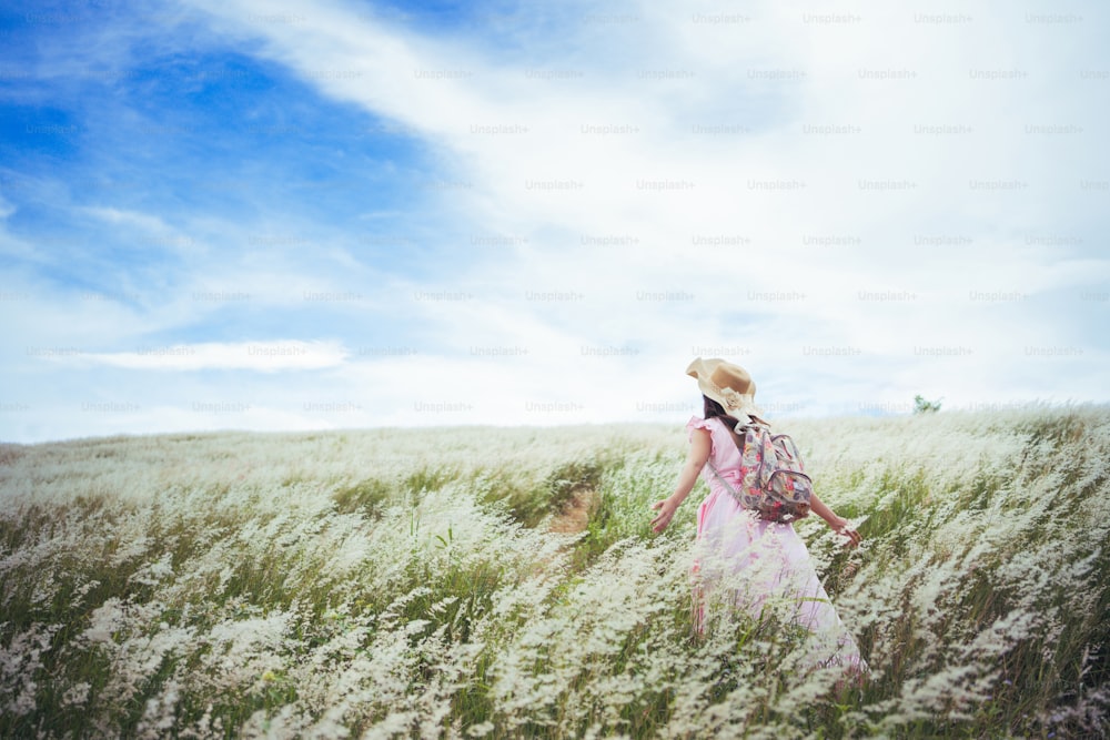 Asian woman She feels freedom on the meadow