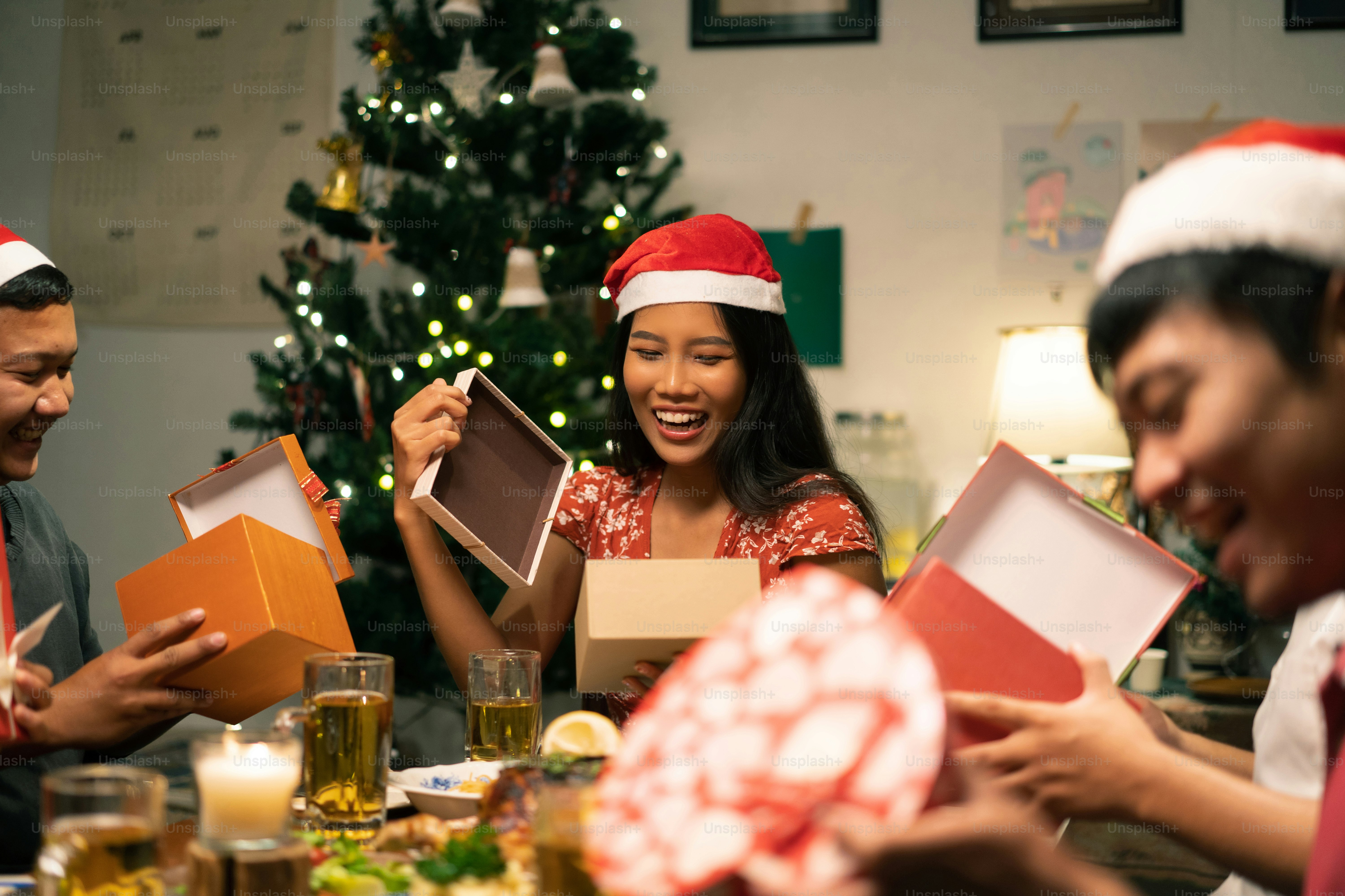 Asian groups have parties. They open New Year's gifts.