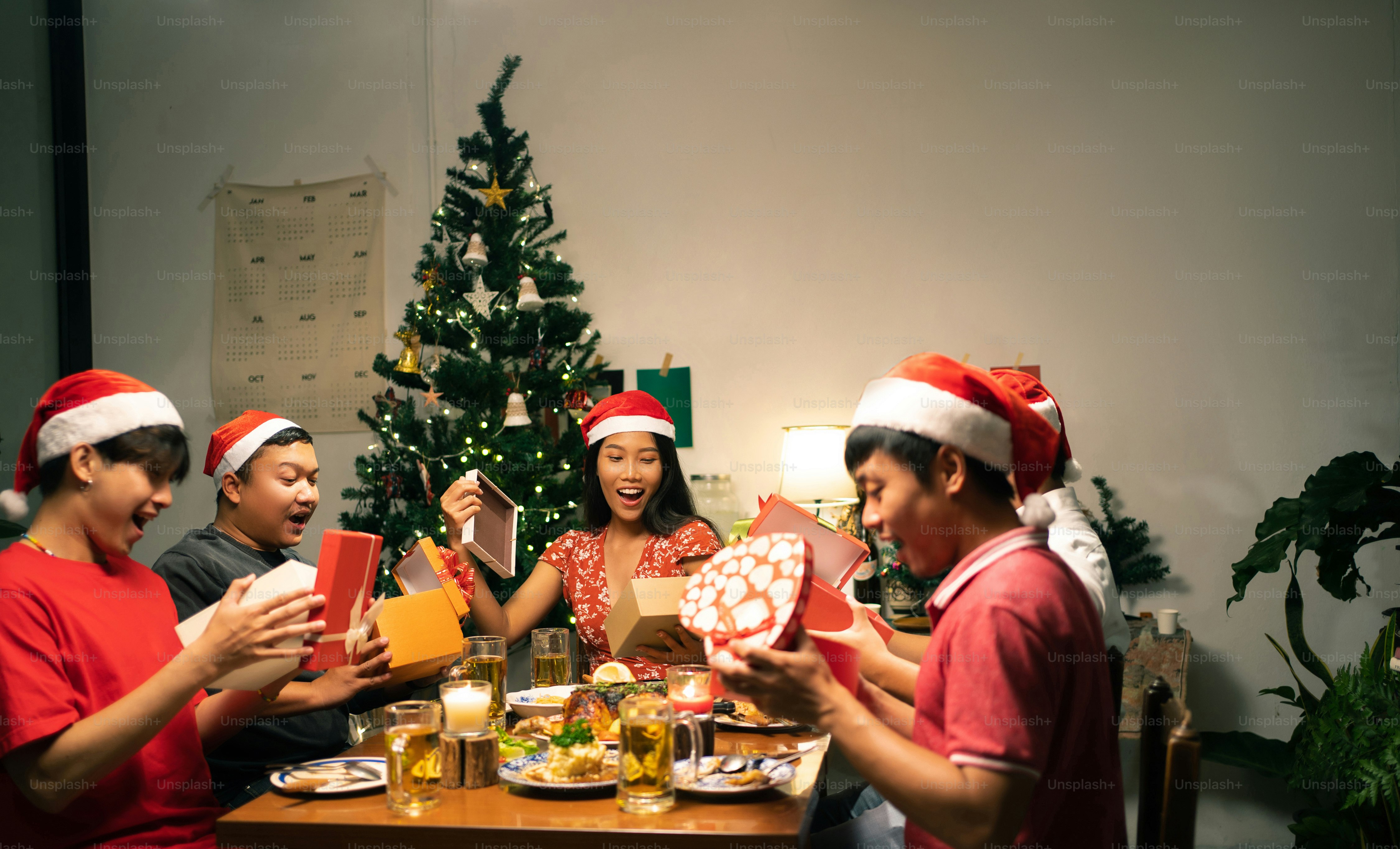 Asian groups have party. they open New Year's gifts.