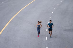 Asian couple, they are jogging and exercising.