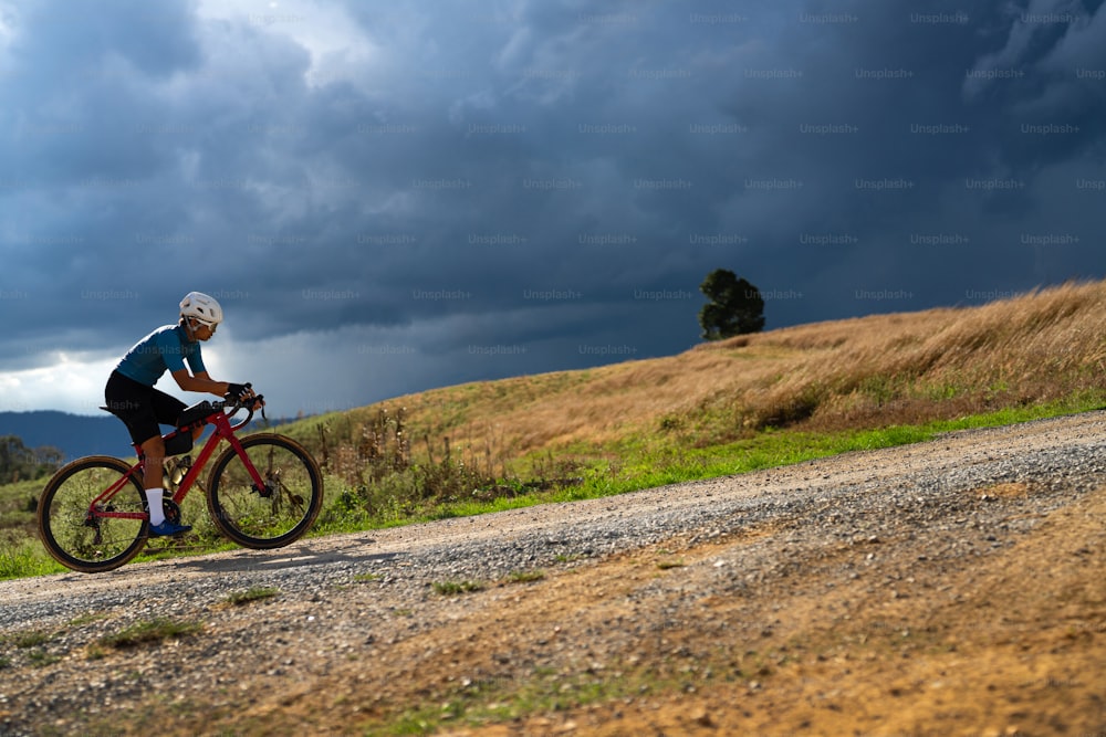 Cyclists practicing on gravel roads in bad weather day