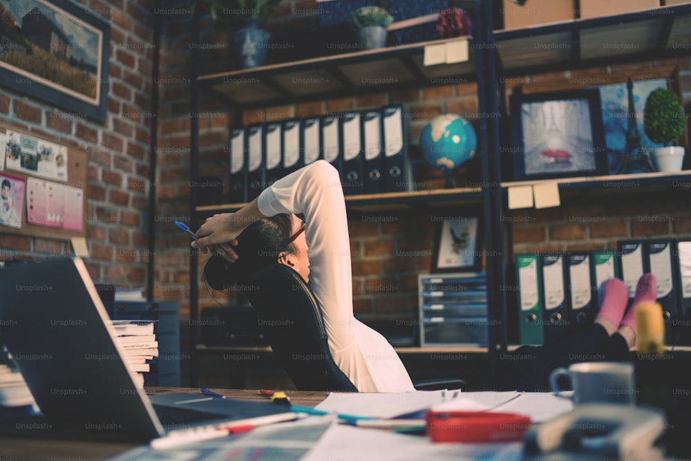 Businesswoman Thinking In office she relax