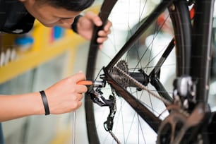 Technicians are repairing bicycles at shop sells