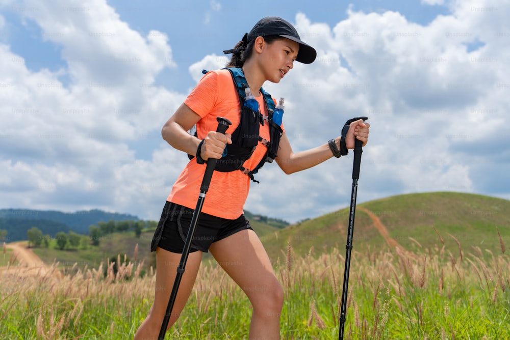 female runner is running the trail