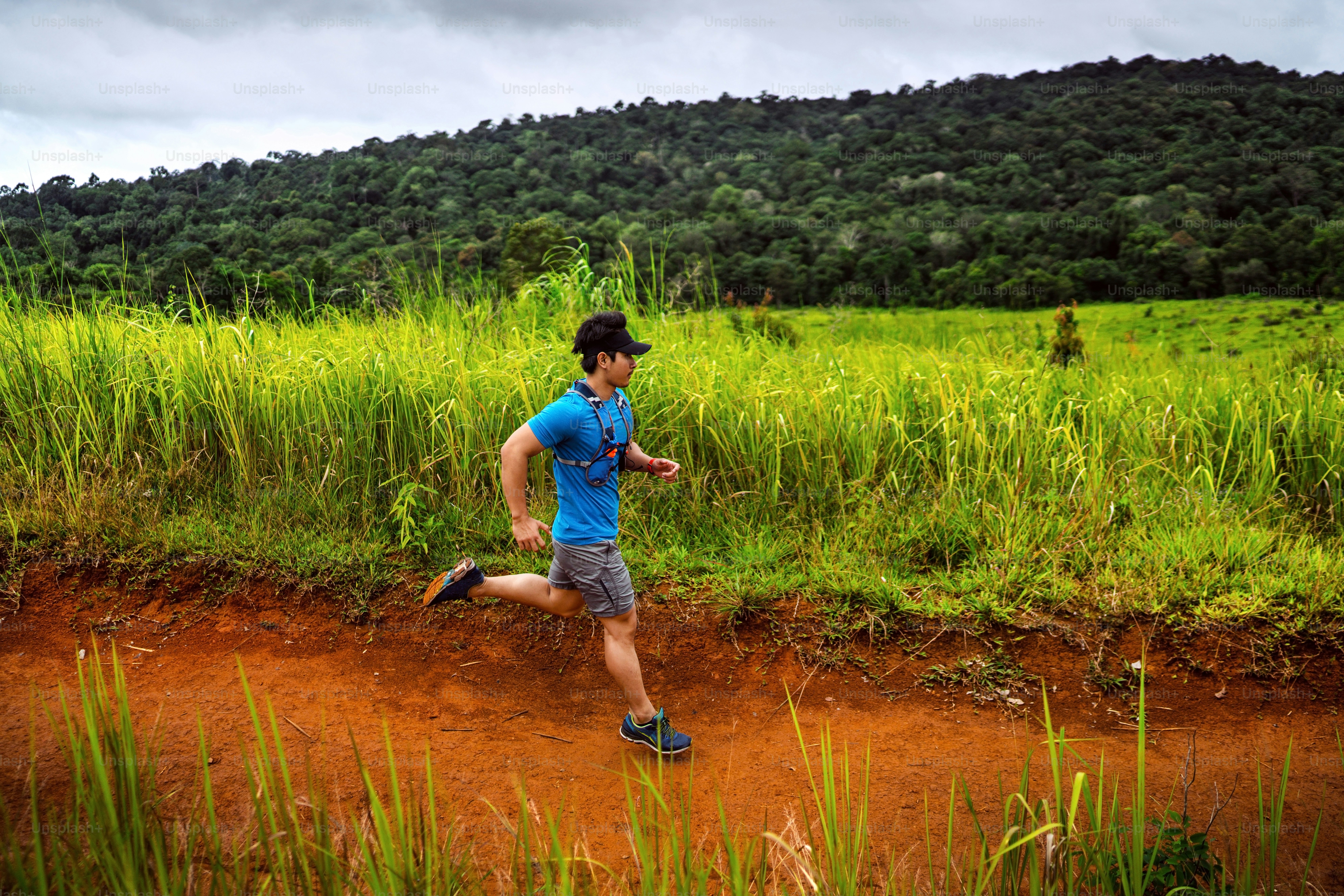 Male Runner of Trail. He was running fast on the mountain