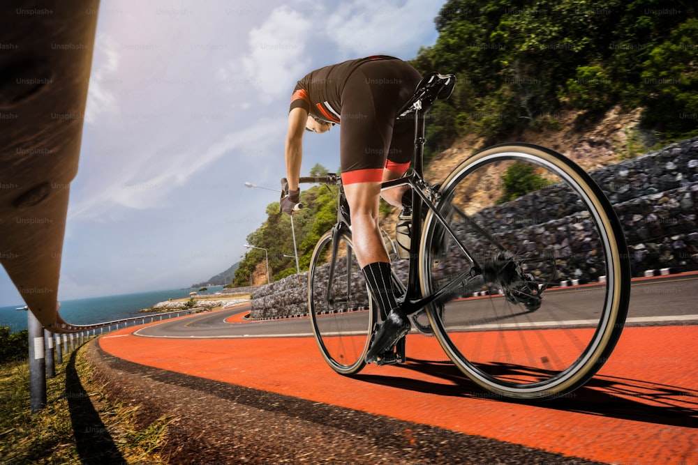 Asian men are cycling road bike in the morning