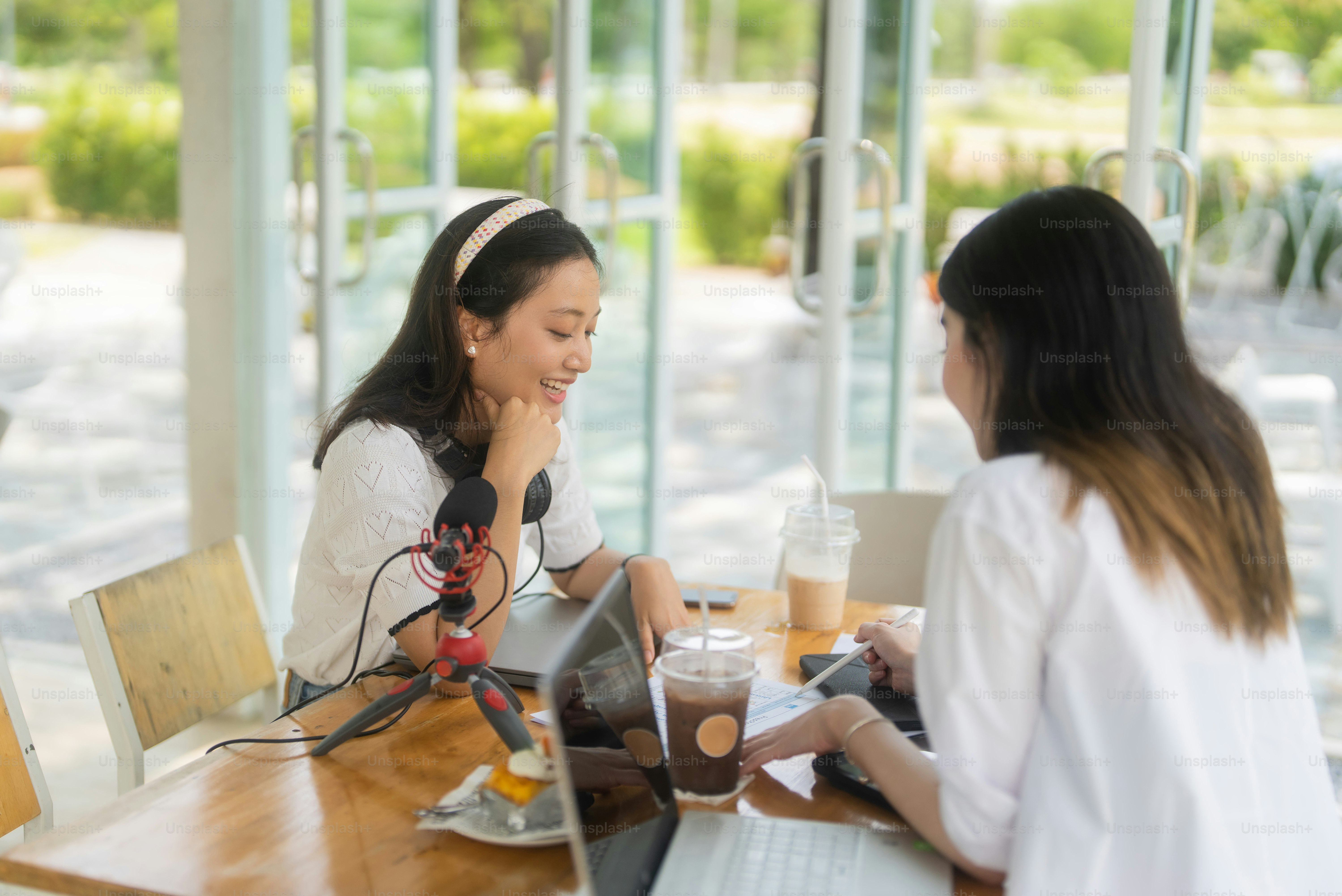 Asians working together in a coffee cafe.
