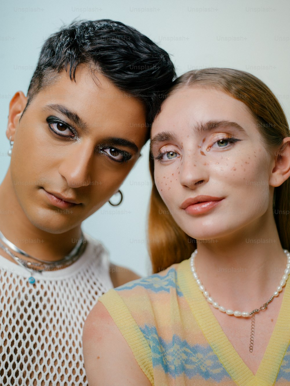 a man and woman posing for a selfie