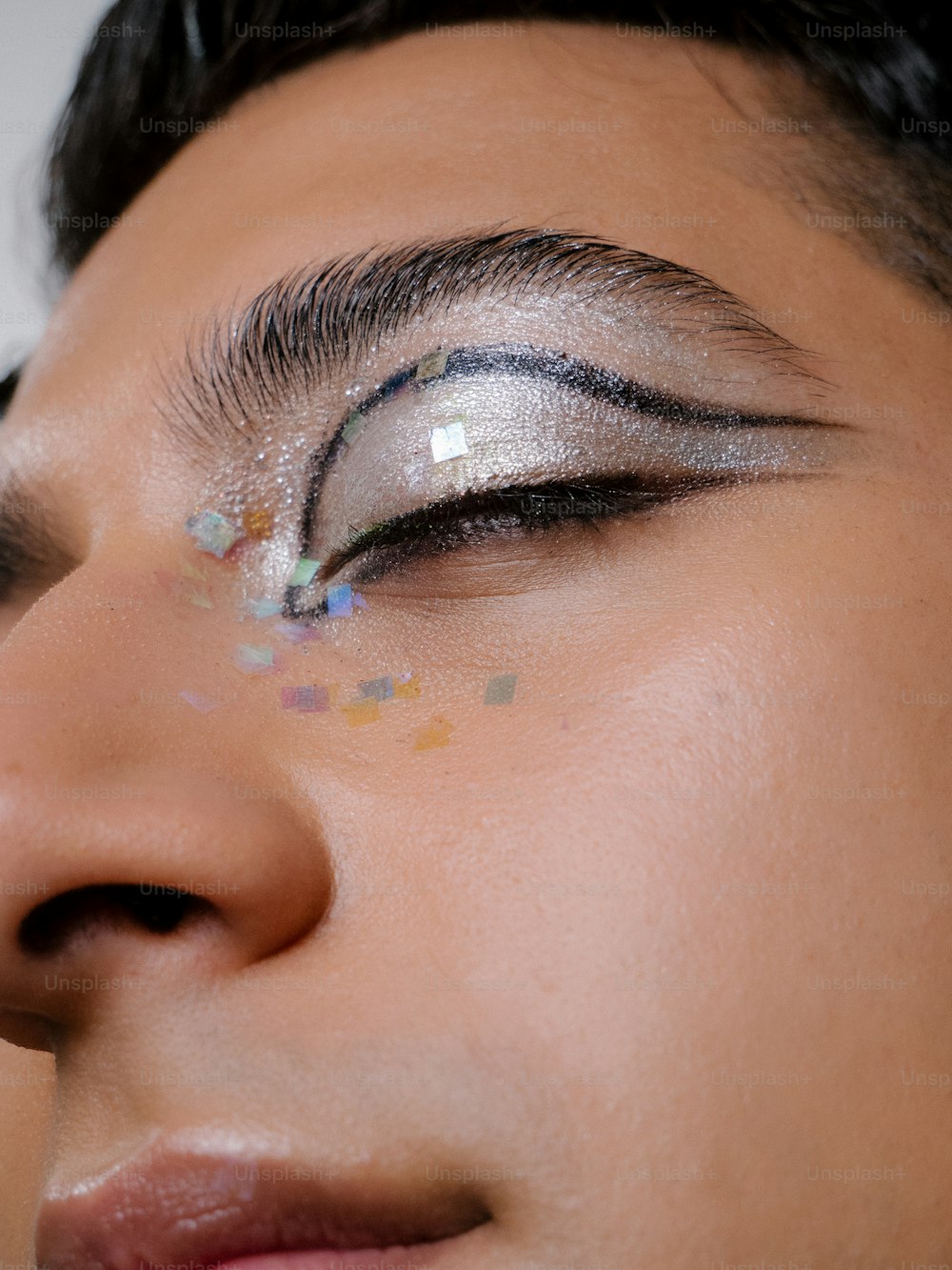 a close up of a person with makeup on