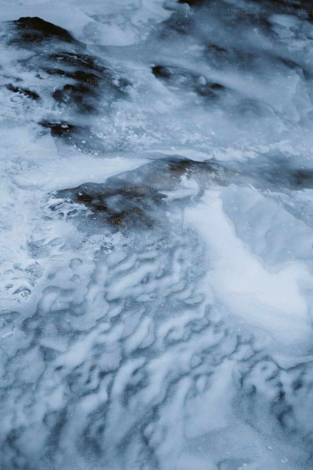 a snowy landscape with rocks