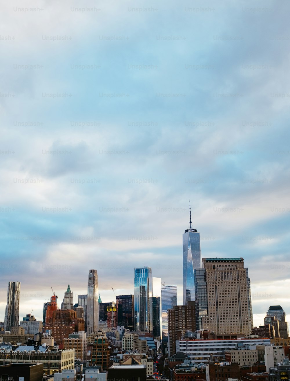 a city skyline with a cloudy sky