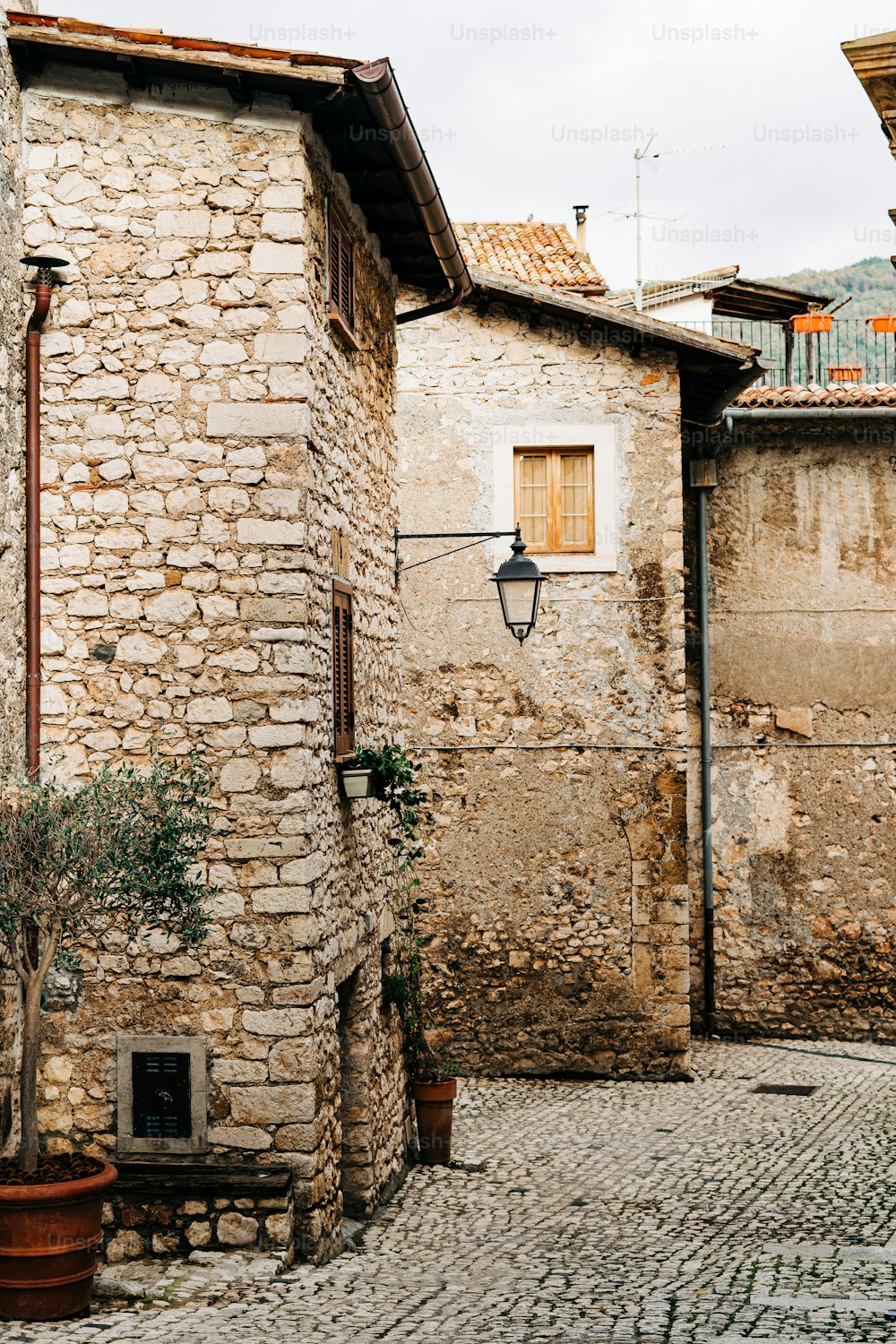 a stone building with a stone wall