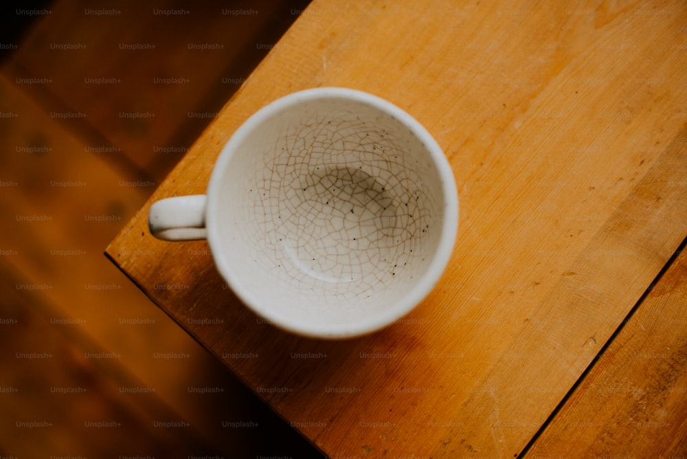 a white plate on a wooden surface