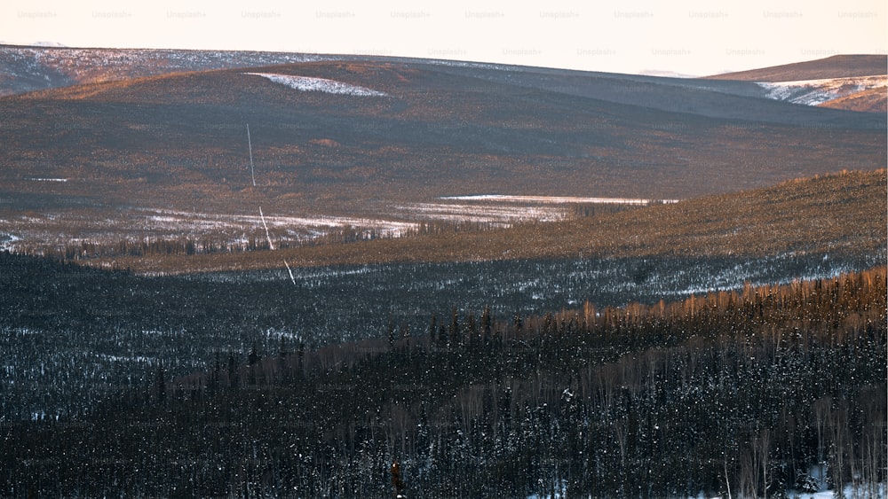 a large body of water with hills in the background