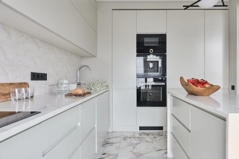 Bespoke fitted kitchen with shaker cabinets and elegant worktops in a Herefordshire home