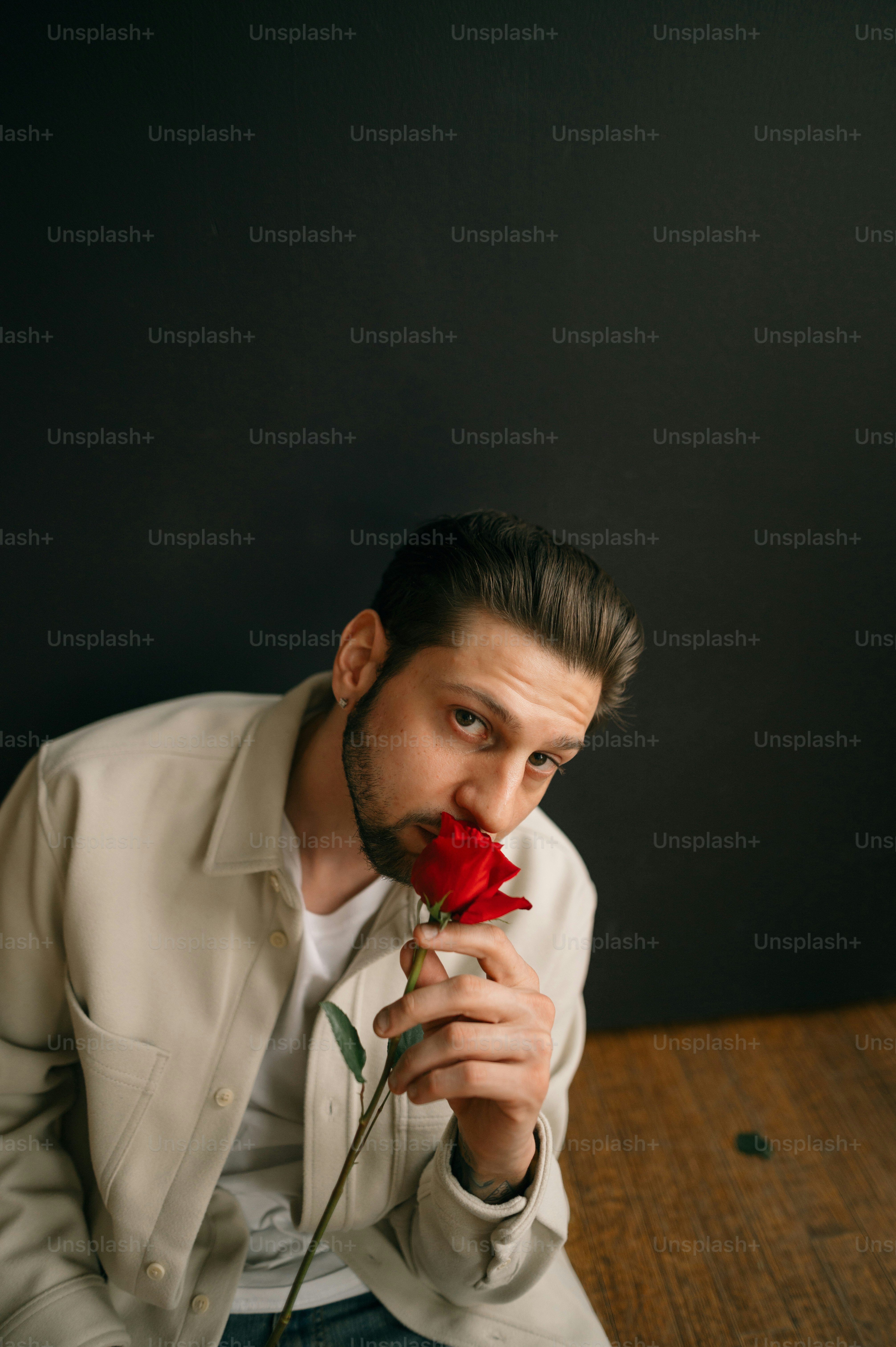 a man holding a rose