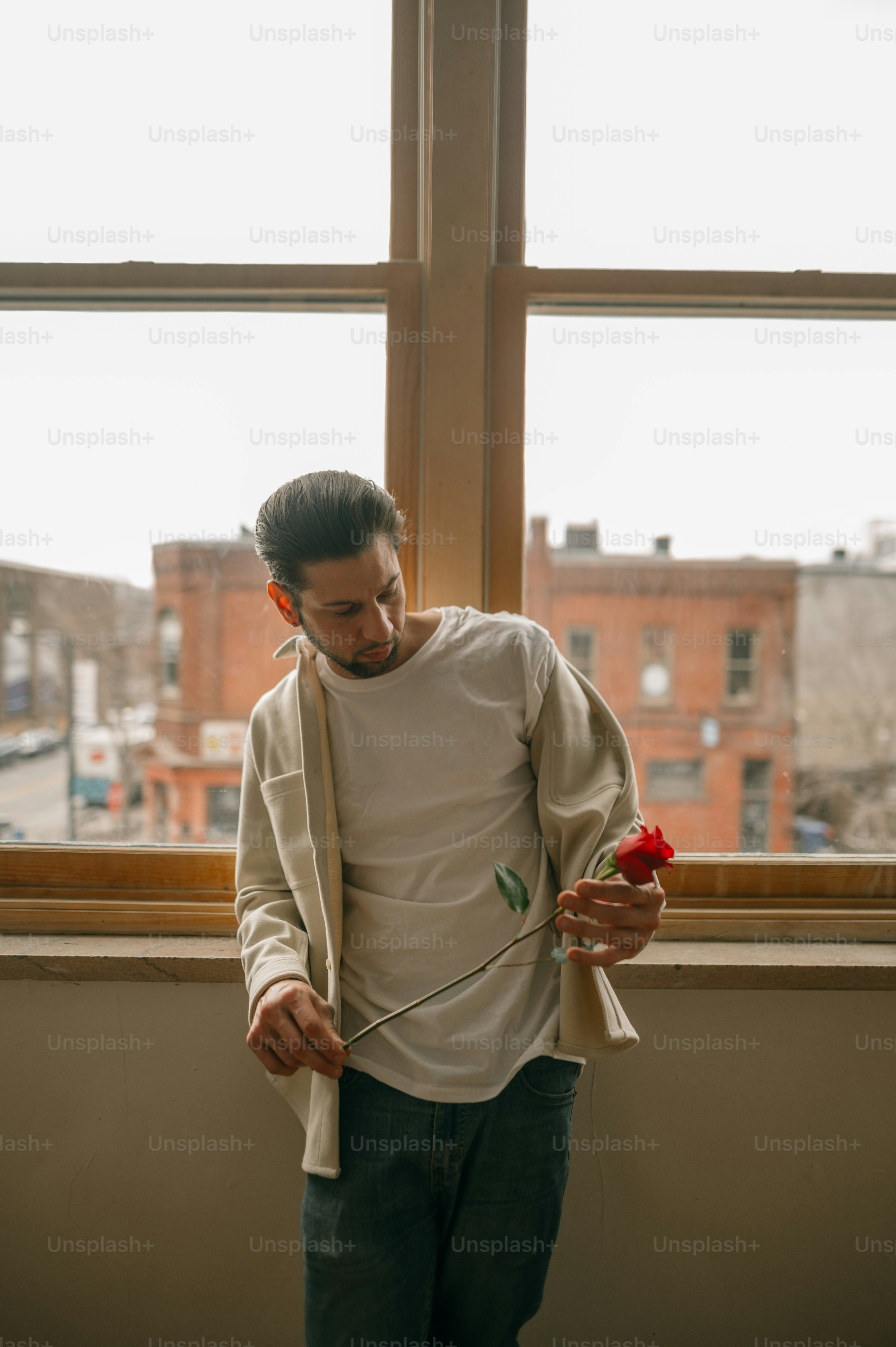 a boy holding a red object
