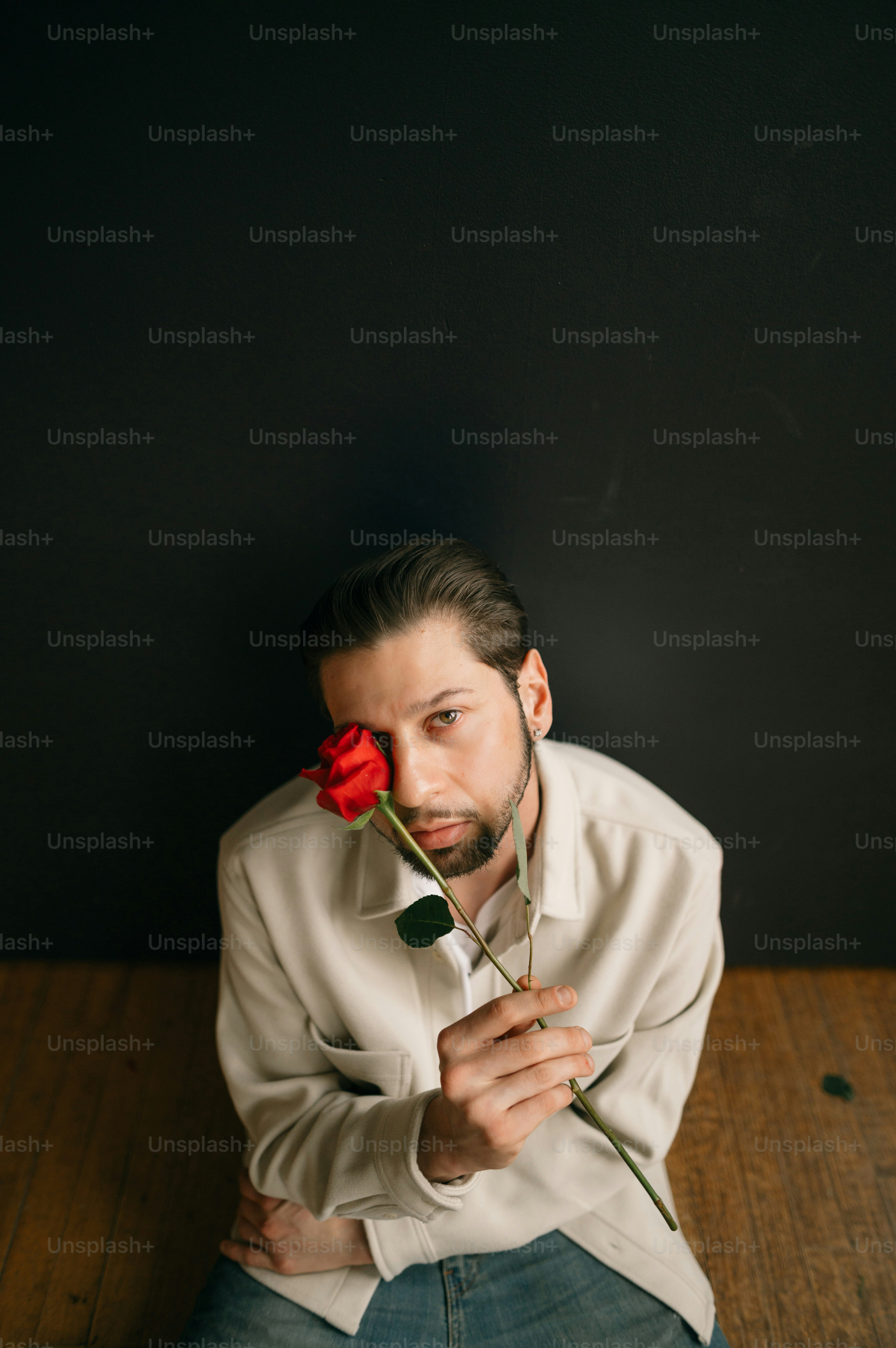 a man holding a rose