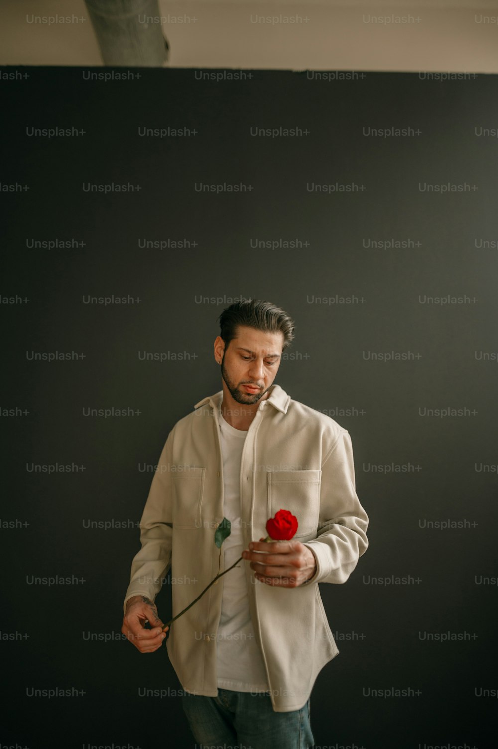 a man holding a red heart