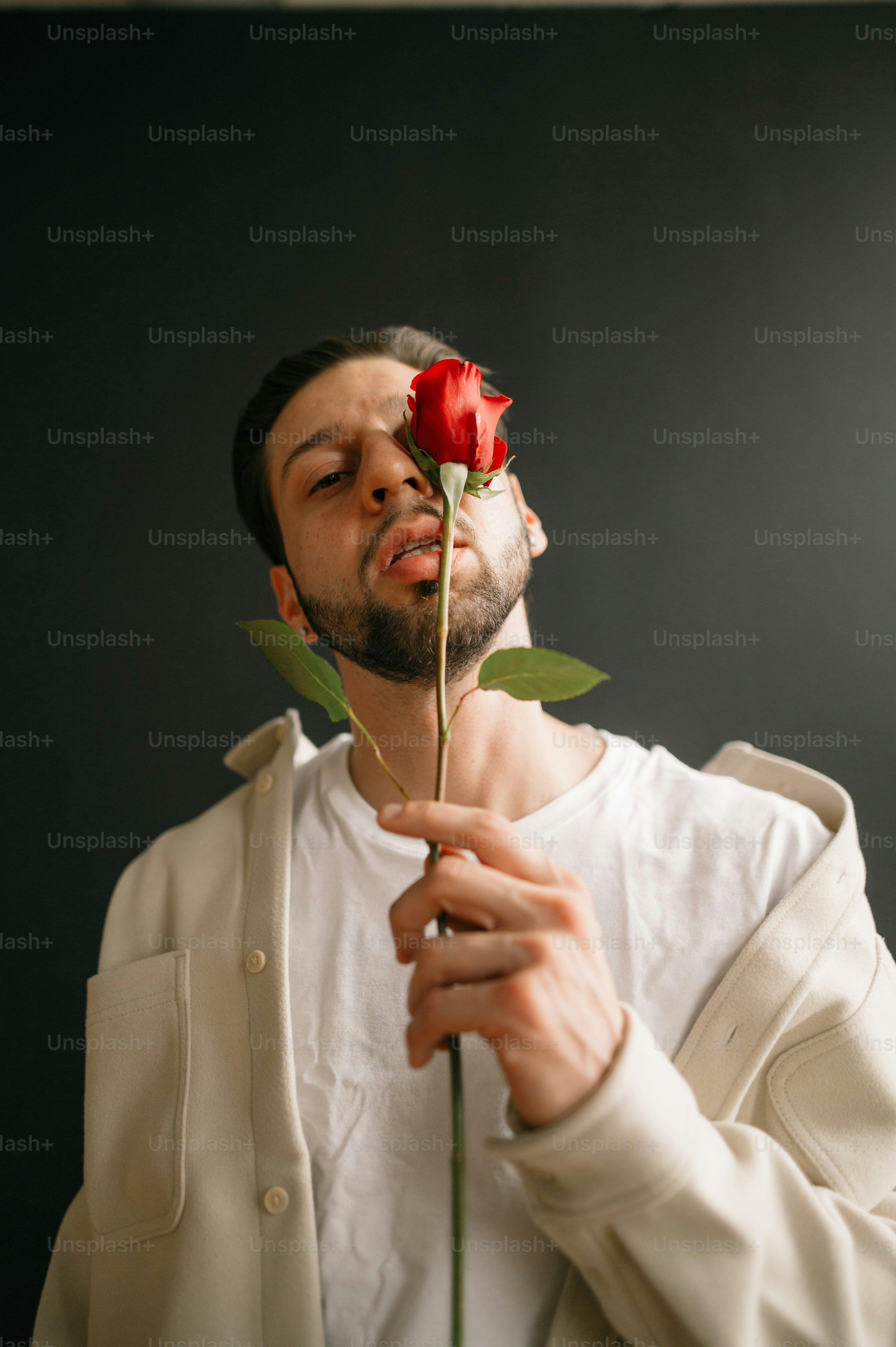 a man holding a rose