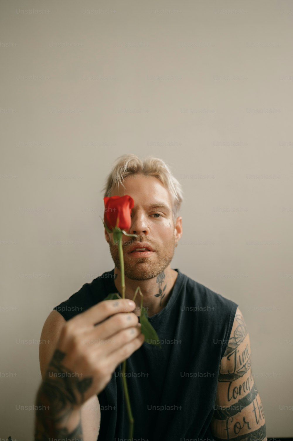 a man holding a rose